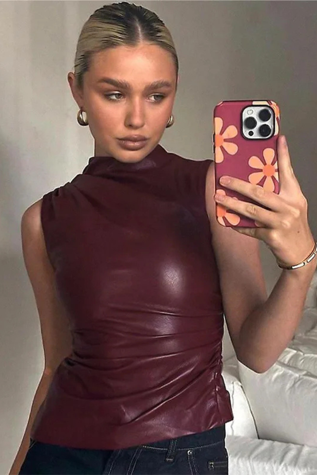 Casual & chic women's sleeveless high neck top for summer. Comfortable brown top, versatile for everyday fashion.