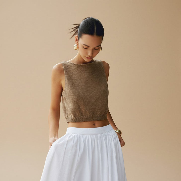 Chic women's sleeveless textured crop top with a clean high neckline. Perfect for summer fashion.