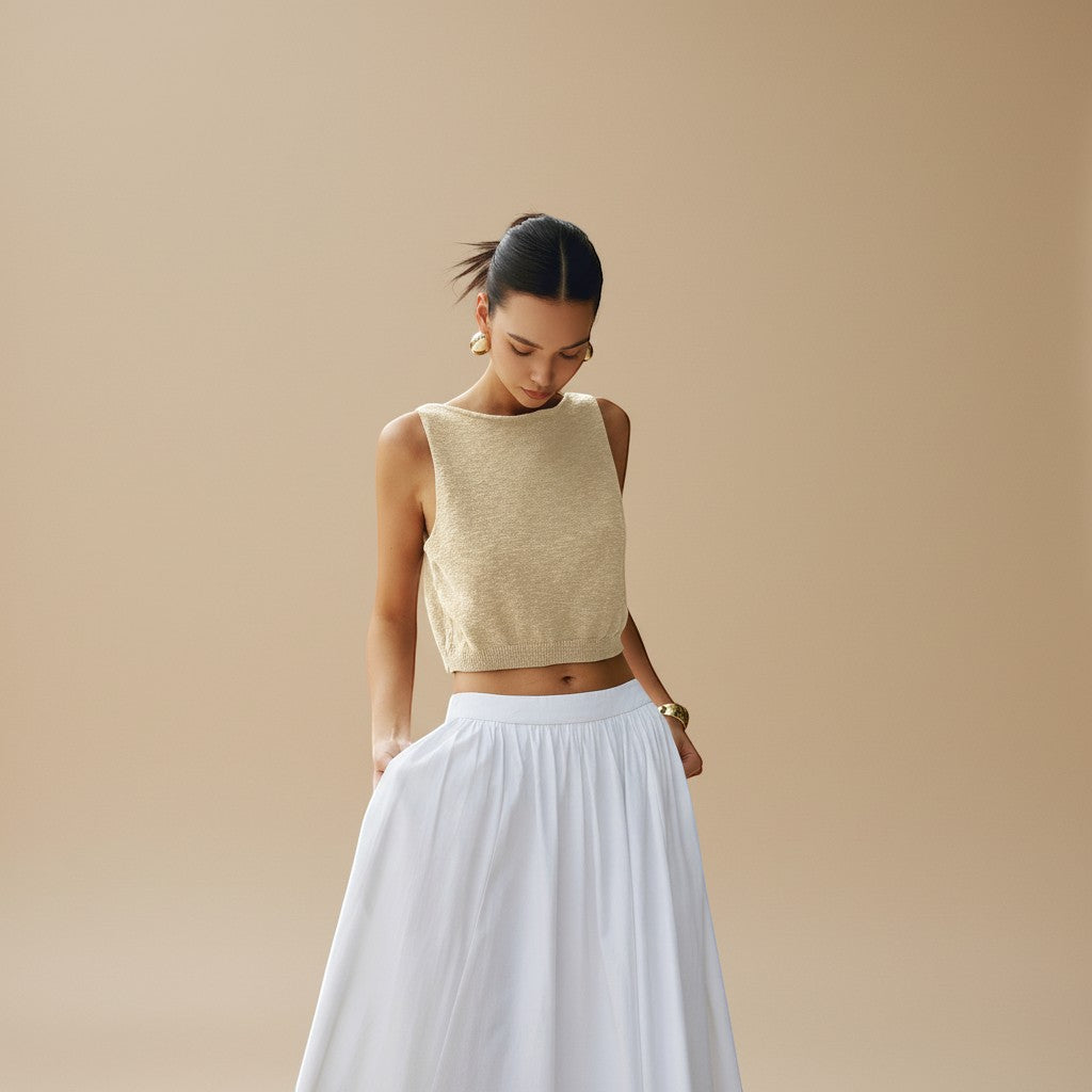 Everyday women's textured crop top. Sleeveless, modern, high neck design for spring/summer fashion.