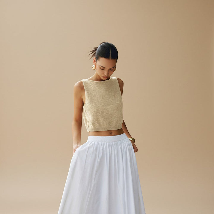 Everyday women's textured crop top. Sleeveless, modern, high neck design for spring/summer fashion.