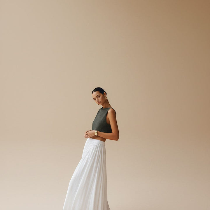 Women's high neck textured crop top. Sleeveless & chic, a versatile piece for modern summer fashion.