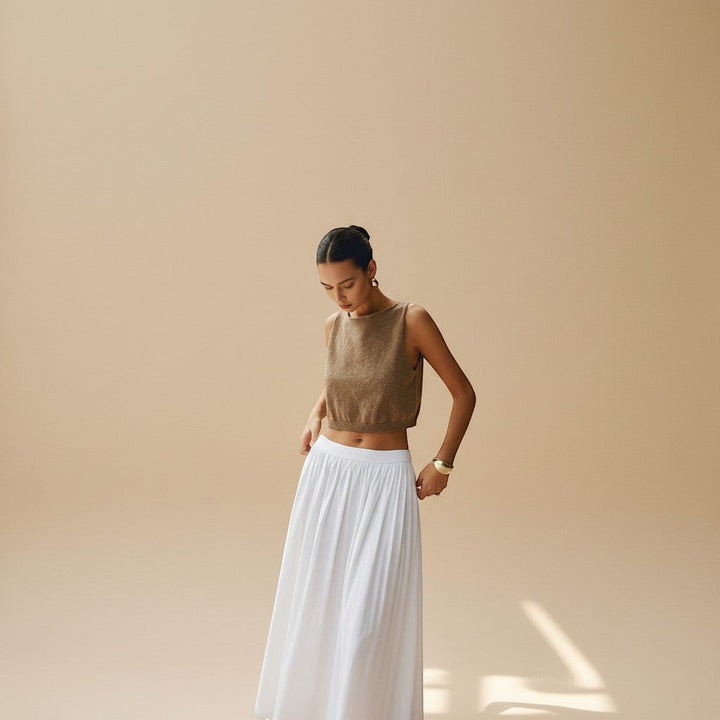 Stylish women's high neck crop top with unique texture. Sleeveless and chic for summer vacation.