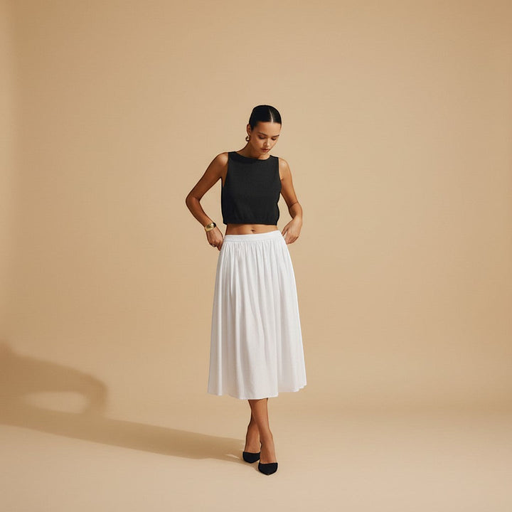 Women's chic sleeveless tank top with clean neckline. Textured crop style for versatile summer wear.