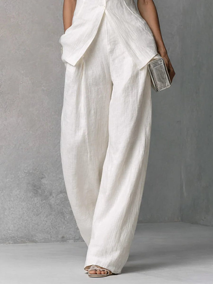 Sleek women's sleeveless wide-leg pant set, featuring a high neck for a chic and polished summer look.