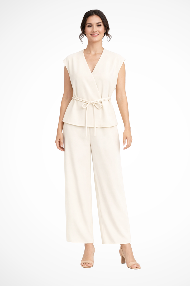 Coordinated women's fashion: sleeveless wrap top & wide leg trousers creating a versatile elegant set.