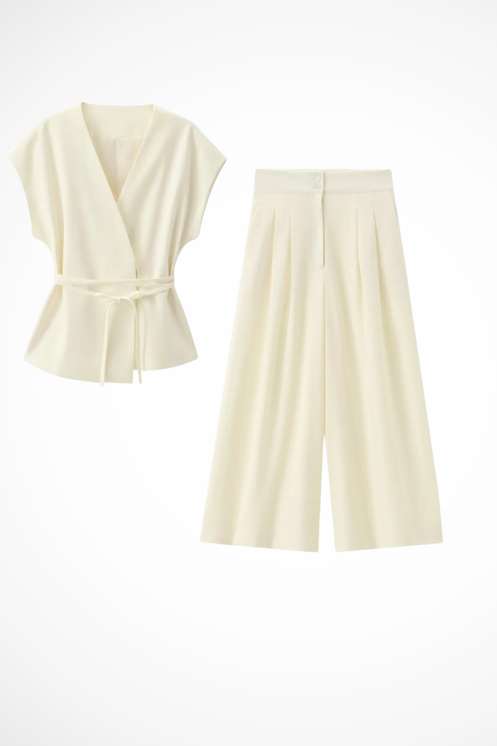 Elegant women's two-piece outfit: sleeveless wrap top and flowy wide leg trousers for a graceful look.