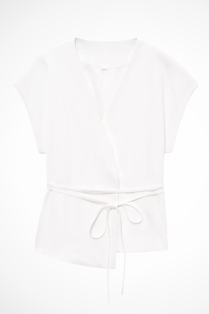 Stylish women's suit set: a sleeveless wrap top and wide leg trousers, perfect for an elegant silhouette.
