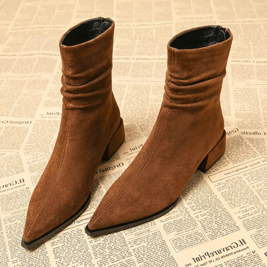 Chic women's slouchy ankle boots with pointed toe & block heel. Versatile autumn/winter fashion footwear.