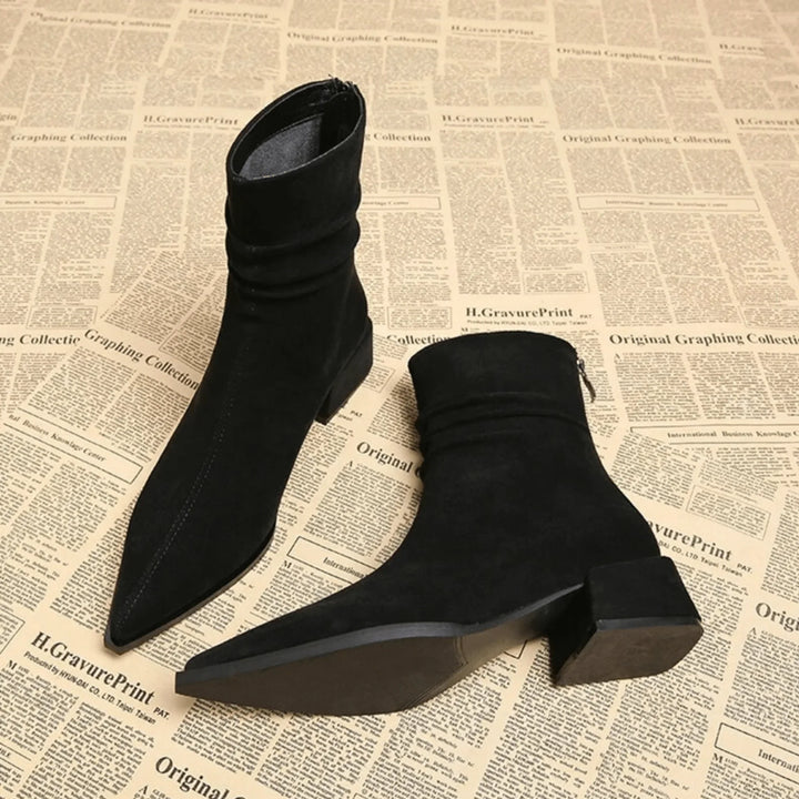 Autumn/winter women's slouchy ankle boots. Pointed toe, block heel. Chic everyday fashion footwear.
