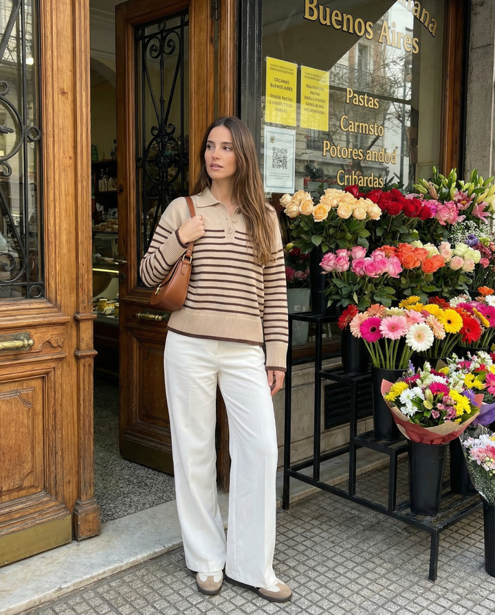 Comfortable women's relaxed fit striped knit polo sweater. Versatile casual pullover for chic autumn wear.