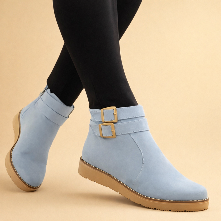 Brown women's chic structured ankle boots with double buckles, offering versatile style for fall & winter.