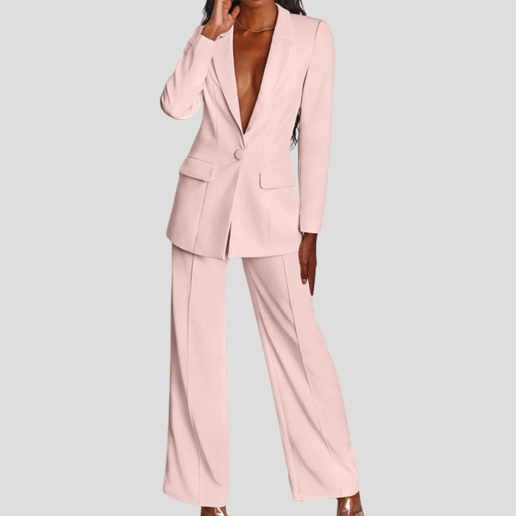 Model wearing a sophisticated women's blazer and trouser set, smart casual style.