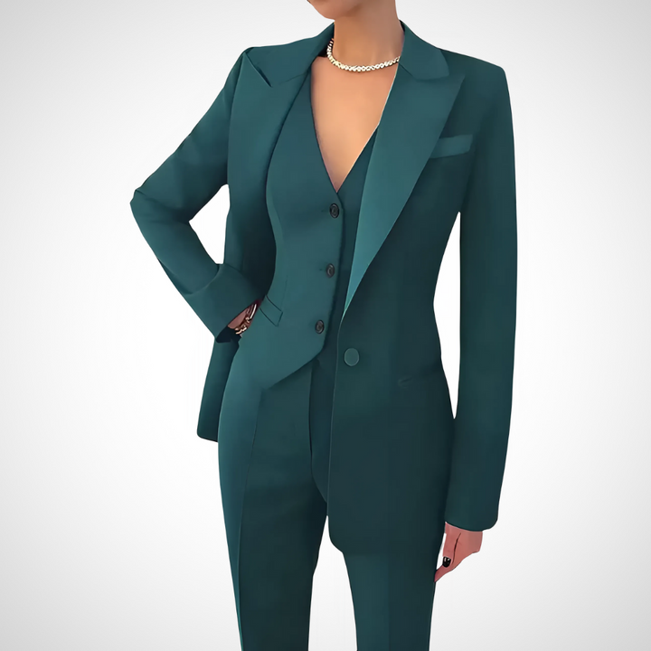 Elegant women's suit: fitted blazer, matching vest & trousers. Professional formalwear for a sophisticated look.
