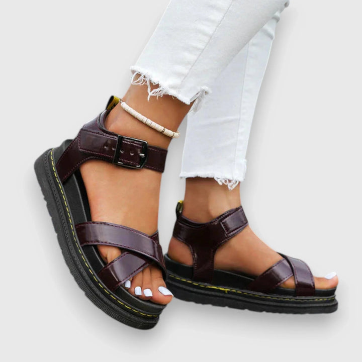 Comfortable teal platform sandals for women with adjustable criss-cross straps, great for chic summer style.