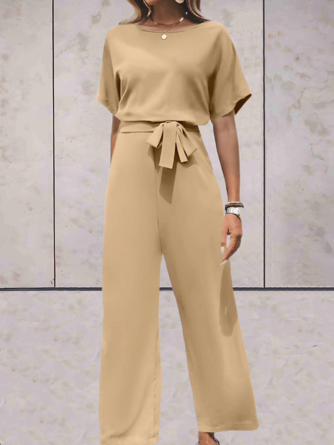 Women's coordinated outfit: stylish short sleeve top and comfortable wide leg pants for casual wear.
