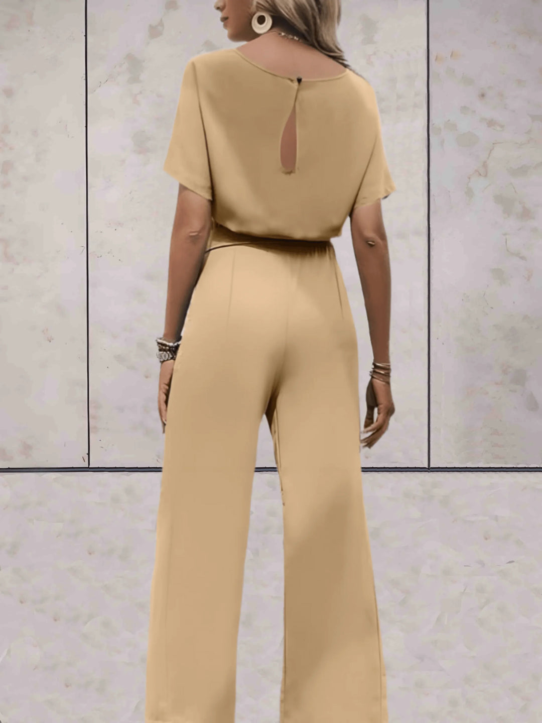 Stylish women's two-piece set, ideal for spring fashion with its short sleeve top and flowy wide leg pants.