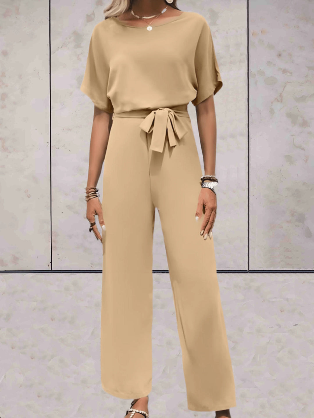 Casual yet elegant women's set featuring a short sleeve top and flattering wide leg pants for comfort.