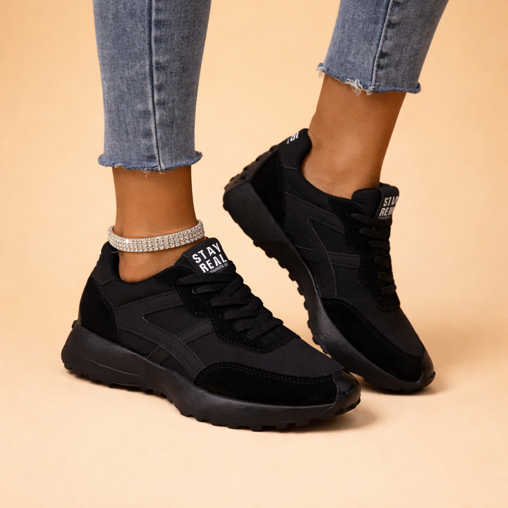 Chic women's urban comfort sneakers for everyday wear. Stylish black fashion footwear, perfect for walking.