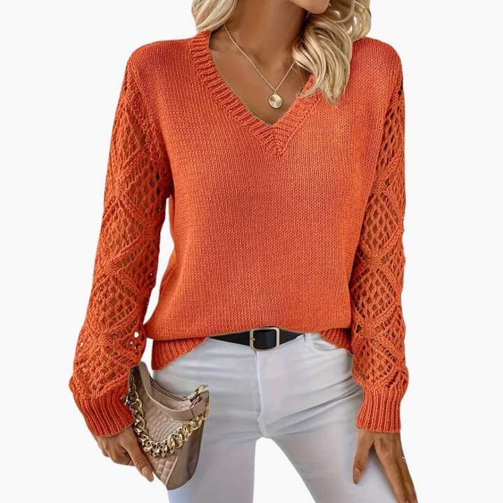 Stylish women's V-neck jumper with unique open sleeve detail. This comfortable long sleeve pullover adds chic to any outfit.