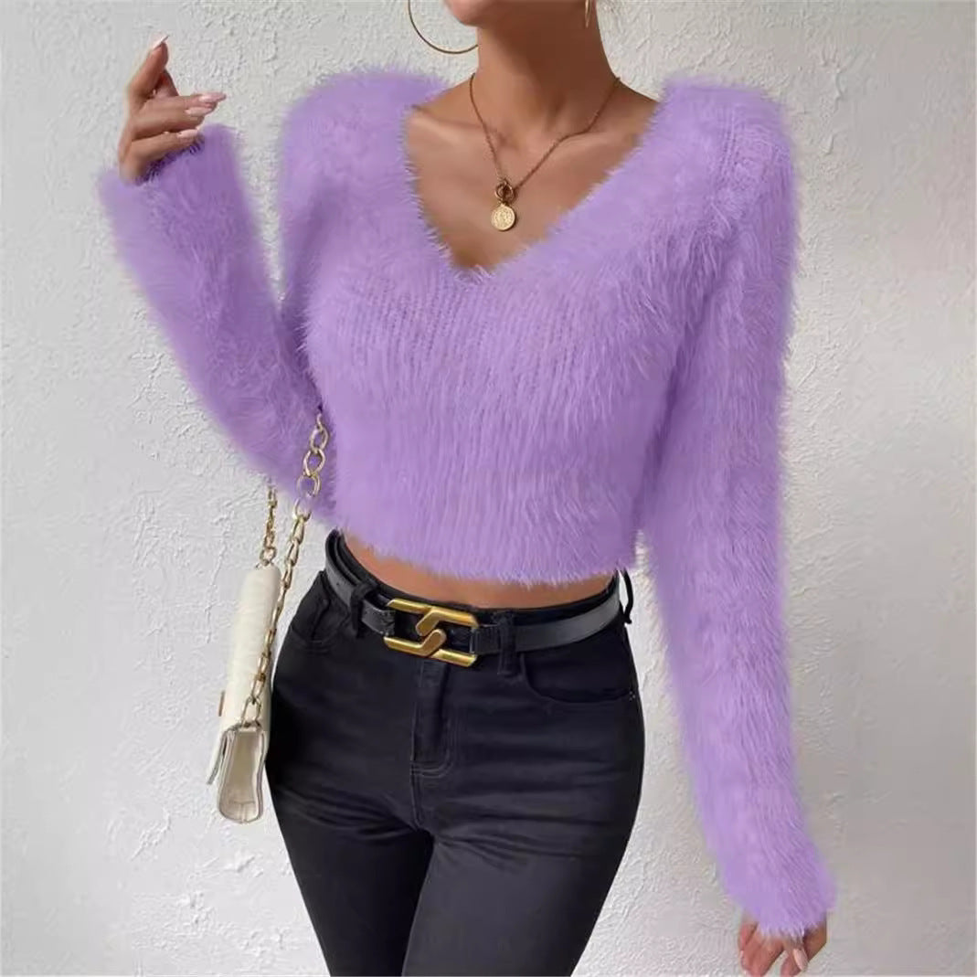 Stylish women's V-neck sweater, featuring long sleeves and a relaxed fit for versatile wear.