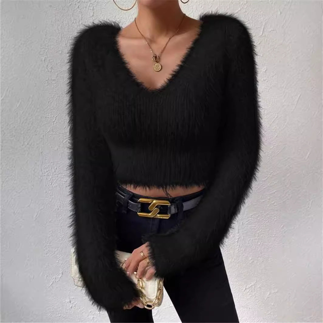 Elegant V-neck knit top for women, with long sleeves, offering a sophisticated and cozy look.