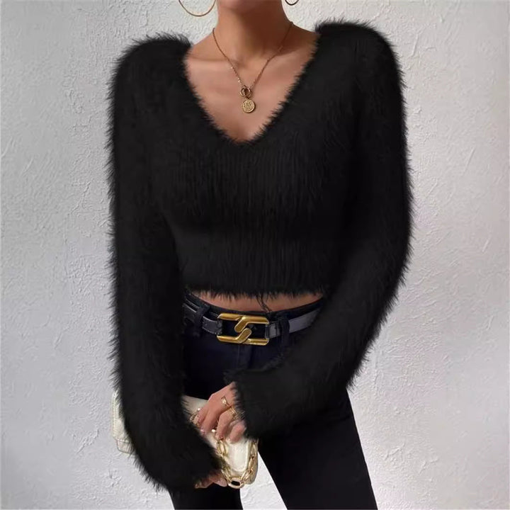 Elegant V-neck knit top for women, with long sleeves, offering a sophisticated and cozy look.