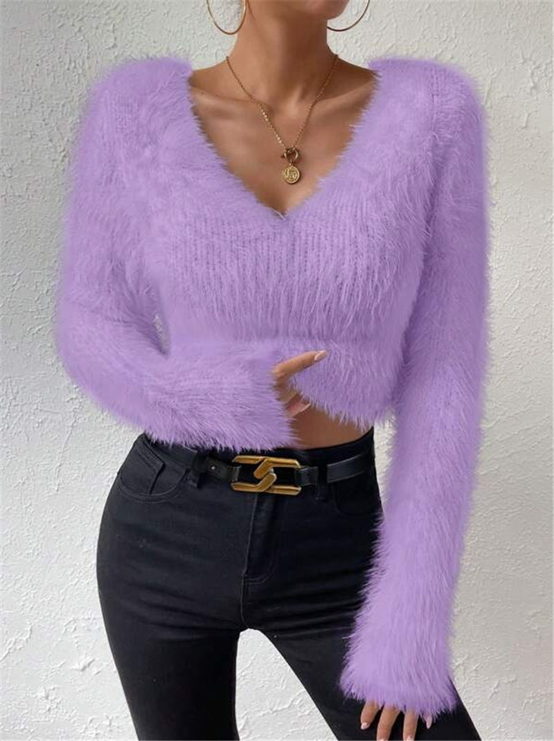 Fashionable women's soft V-neck sweater, long sleeves, great for stylish everyday wear and layering.