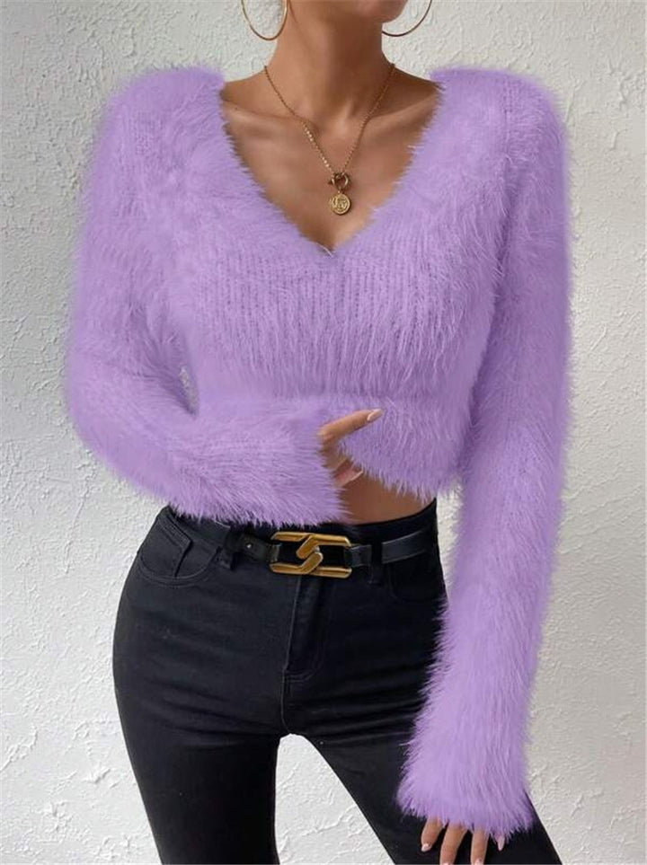 Fashionable women's soft V-neck sweater, long sleeves, great for stylish everyday wear and layering.
