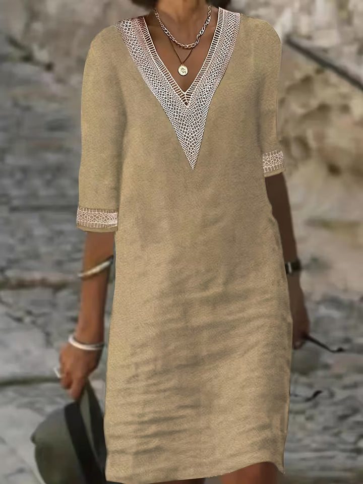 Comfortable women's mid-sleeve V-neck dress, perfect for casual or elegant occasions. Versatile fashion.