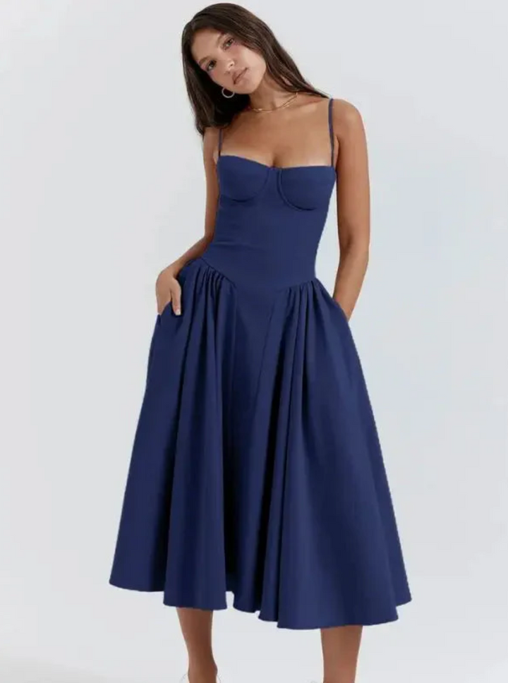 Sleeveless V-neck midi summer dress for women. Ideal casual beachwear or vacation fashion.
