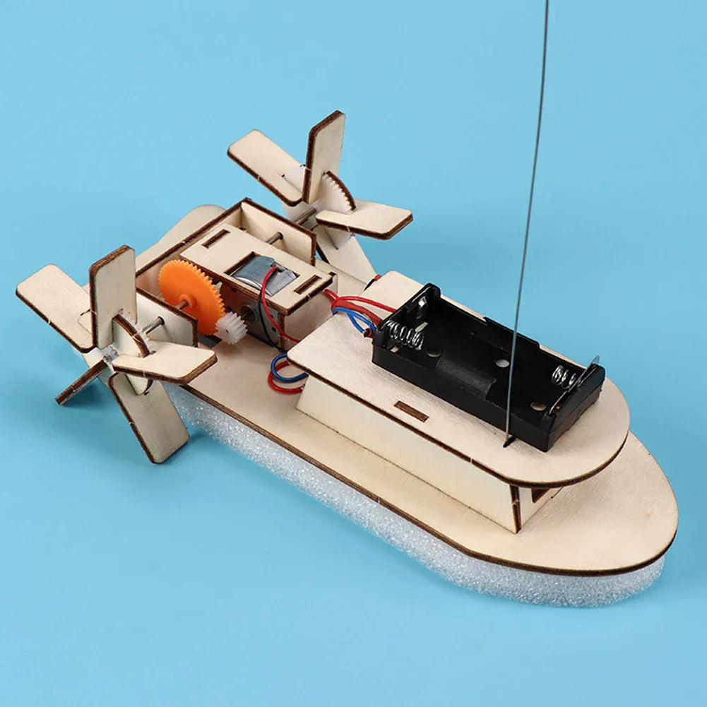 Close-up of wooden pieces for children's educational DIY electric toy boat kit.