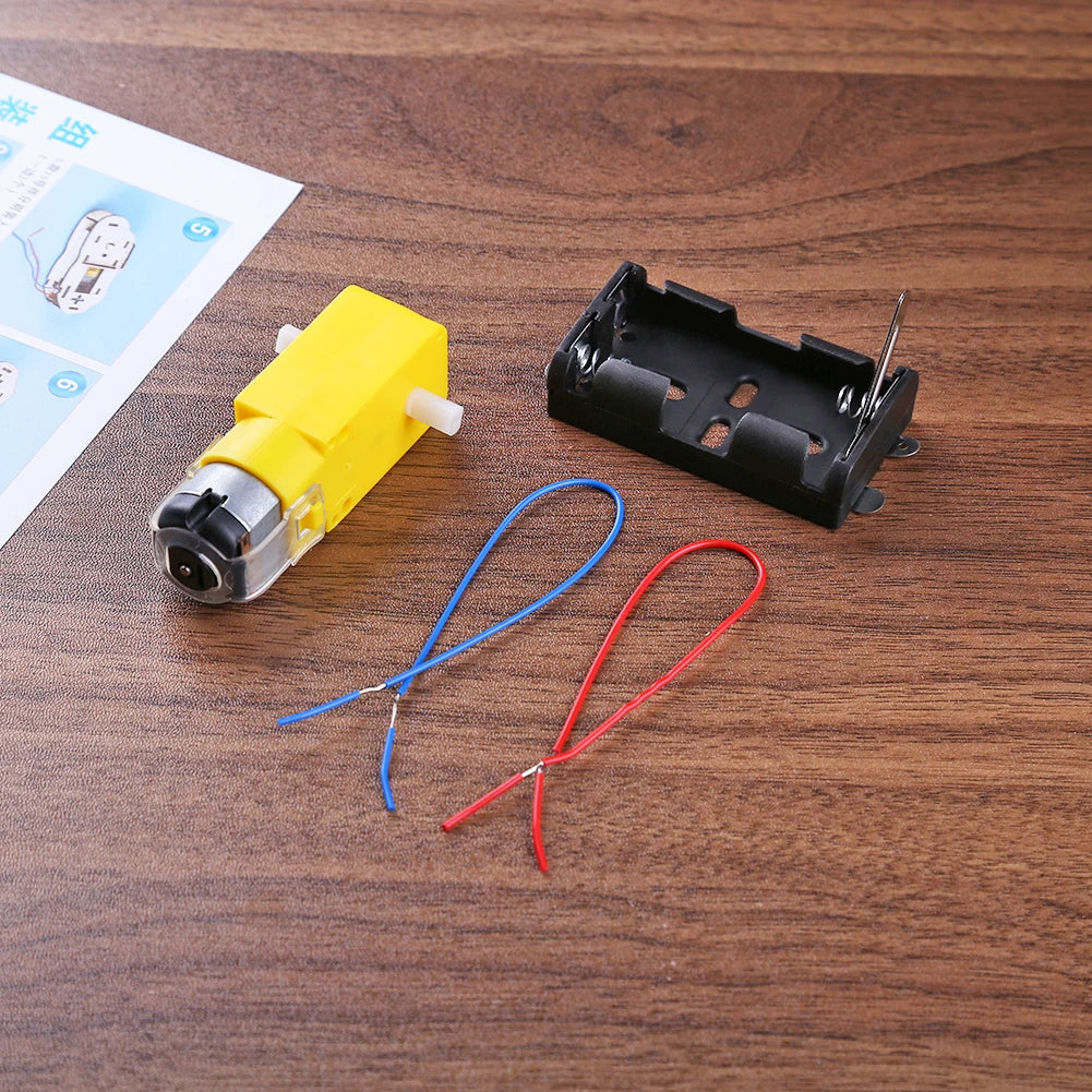 Child's hands assembling a wooden DIY electric boat, part of an educational kit.