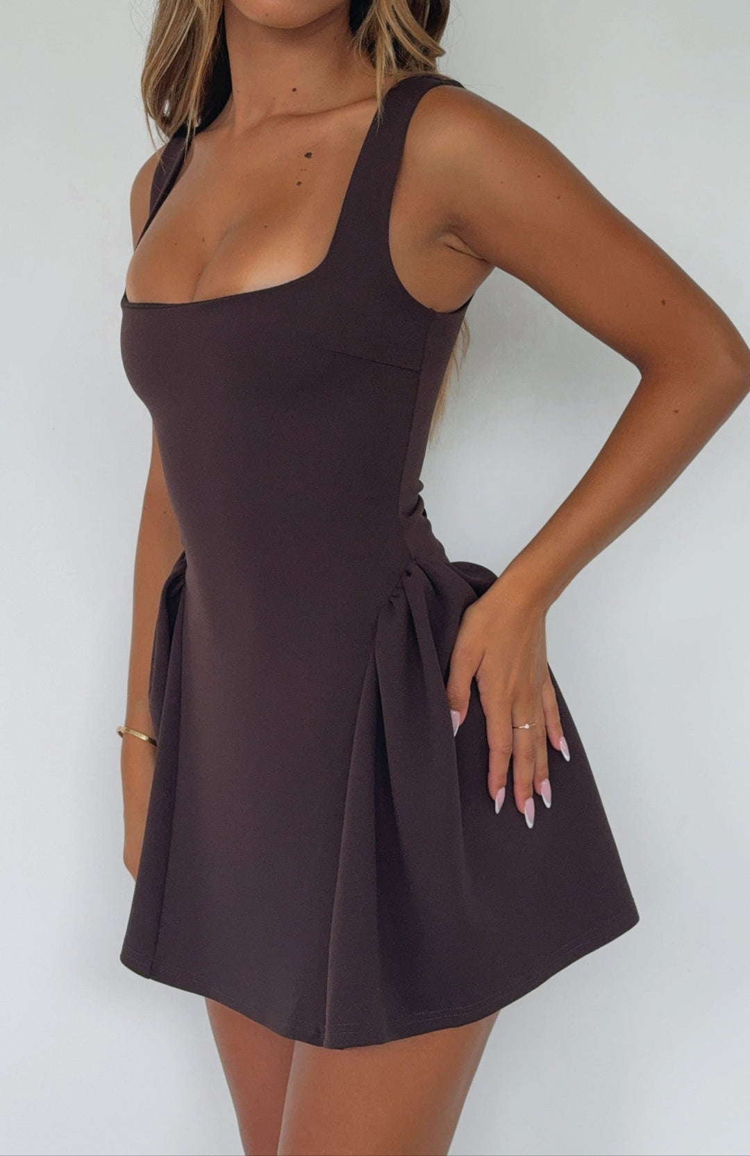 A trendy chocolate lace-up dress with a sophisticated square neckline, ideal for parties.
