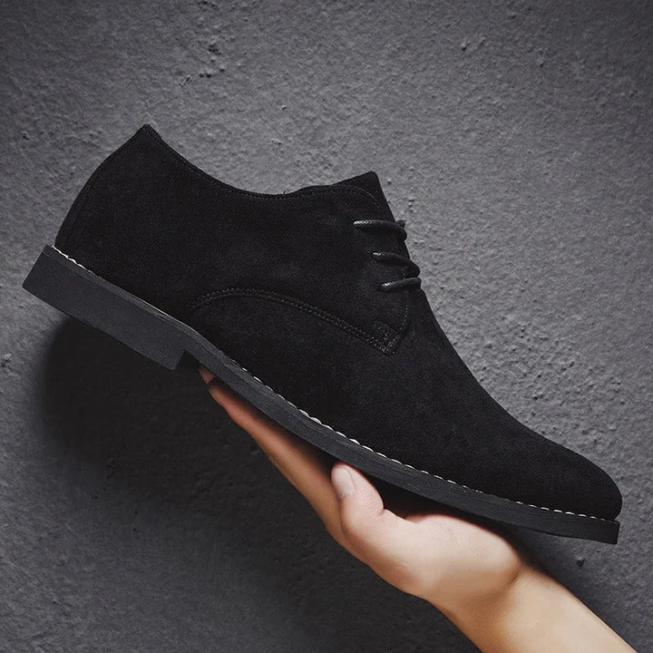 Timeless men's classic black lace-up dress shoes, ideal for formal parties and professional settings.