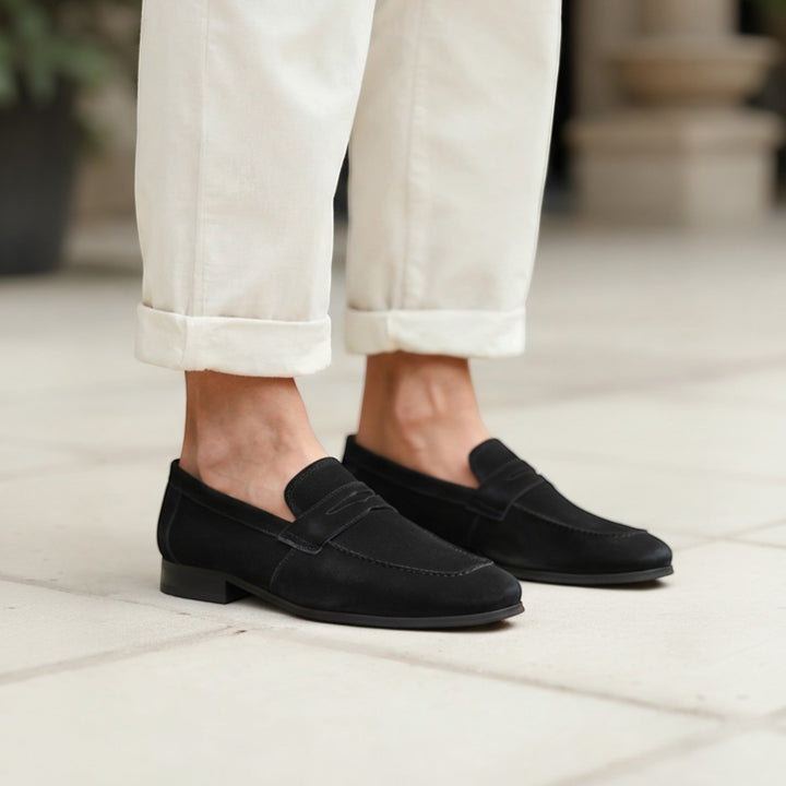 Classic black leather men's loafers for business & formal wear. Comfortable slip-on dress shoes.