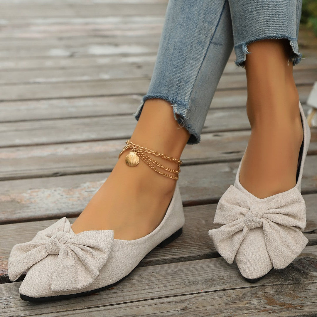 Stylish orange women's bow detail ballet flats, offering comfort and a pop of color for daily fashion.