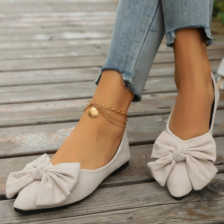 Stylish orange women's bow detail ballet flats, offering comfort and a pop of color for daily fashion.