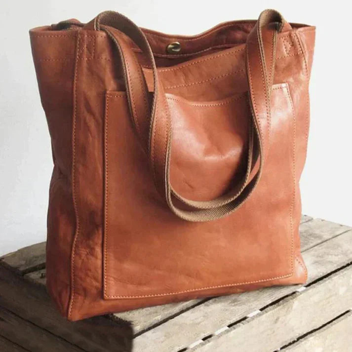Classic brown women's shoulder bag, elegant design for everyday style. Perfect chic accessory & versatile handbag.