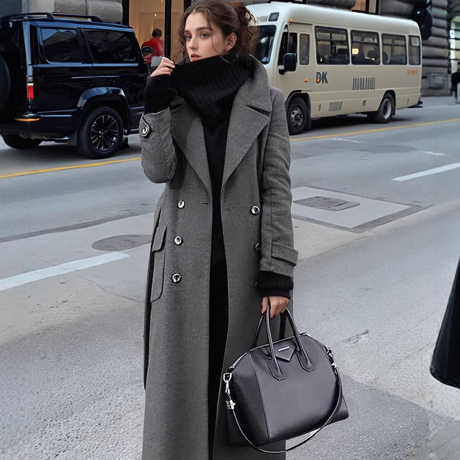 Sophisticated women's long double-breasted winter coat in a timeless design, ideal for cold weather fashion.
