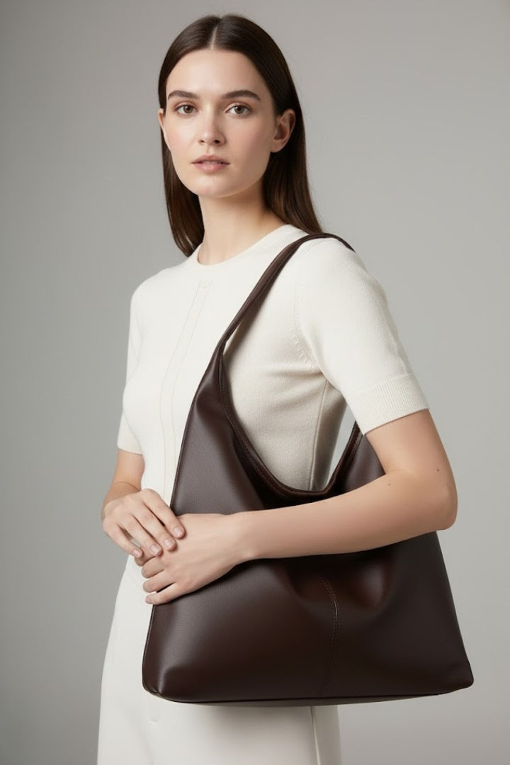 Spacious faux leather women's tote bag with large inner pocket for organization.