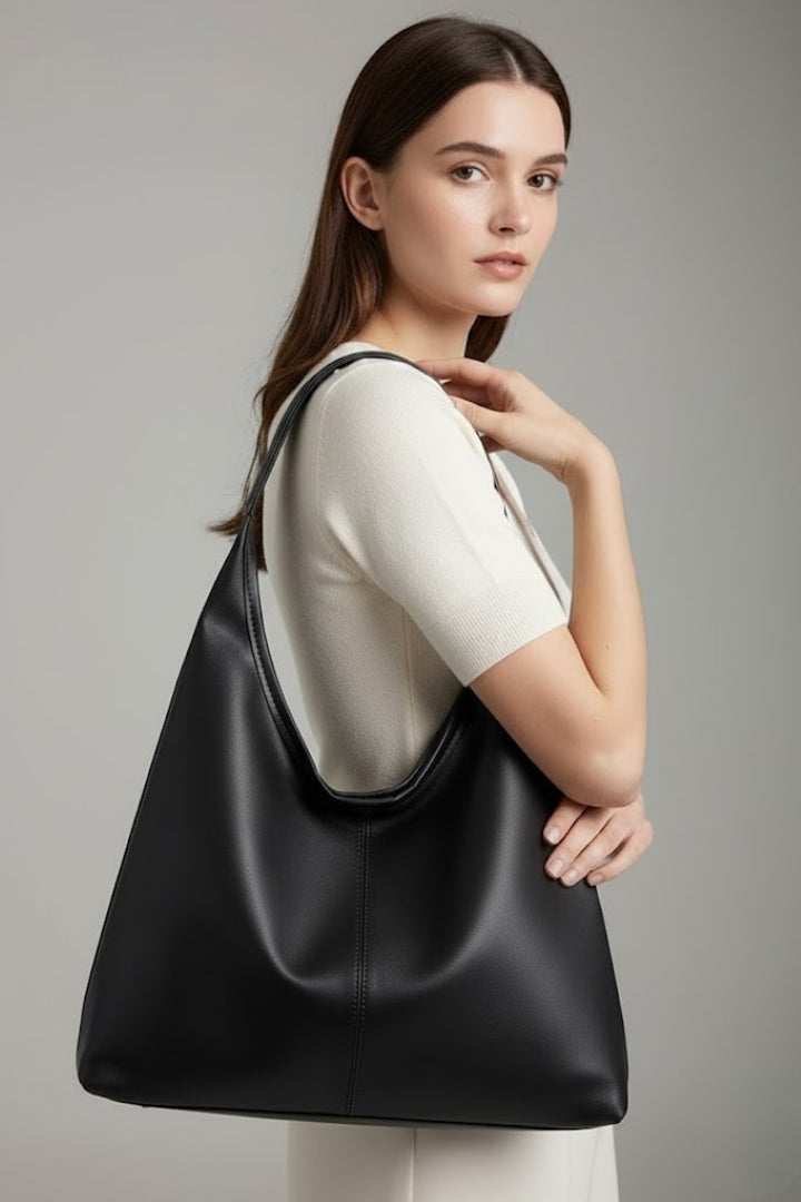 Professional women's classic faux leather tote bag, perfect for work.