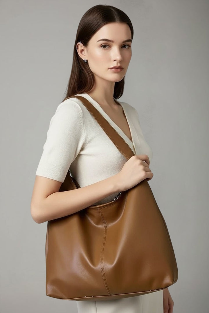 Large faux leather tote bag for women, a spacious and stylish everyday accessory.