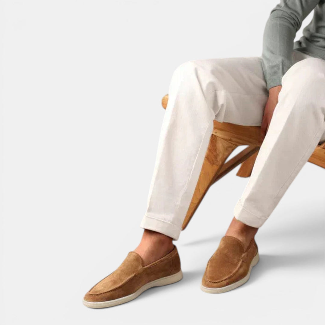 Elegant black leather men's slip-on loafers, perfect casual footwear for fashion-forward men.