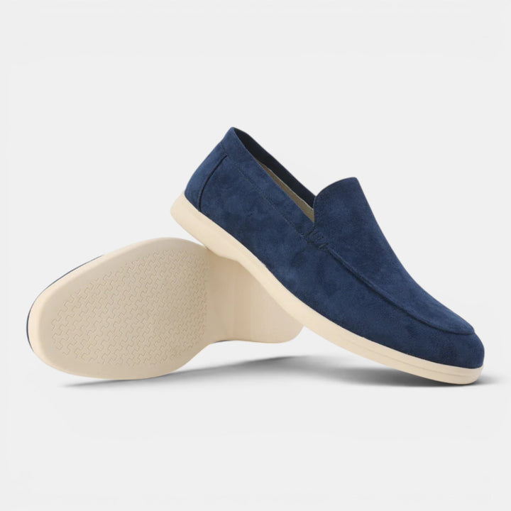 Versatile navy men's slip-on loafers, offering effortless style & all-day comfort for any occasion.