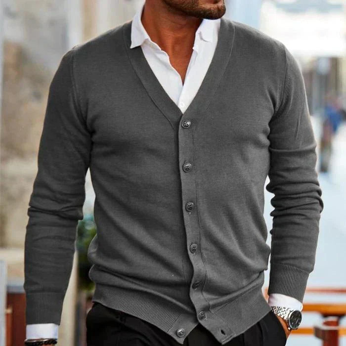 Men's classic button-down cardigan sweater. Long-sleeve V-neck style with convenient front pockets & ribbed details.
