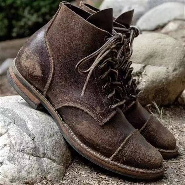 Classic men's leather boots in dark brown, featuring a timeless ankle-high design for comfort & versatile styling.