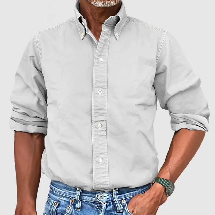 Man wearing a versatile long-sleeve button-down shirt for casual or office wear.
