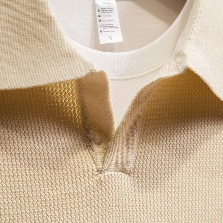 Relaxed fit men's long sleeve polo sweater. Versatile knit top, a wardrobe essential for men.