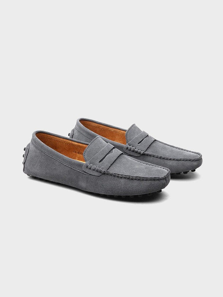 Iconic men's penny loafers with classic slot detail, slip-on shoes offering timeless elegance & comfort.