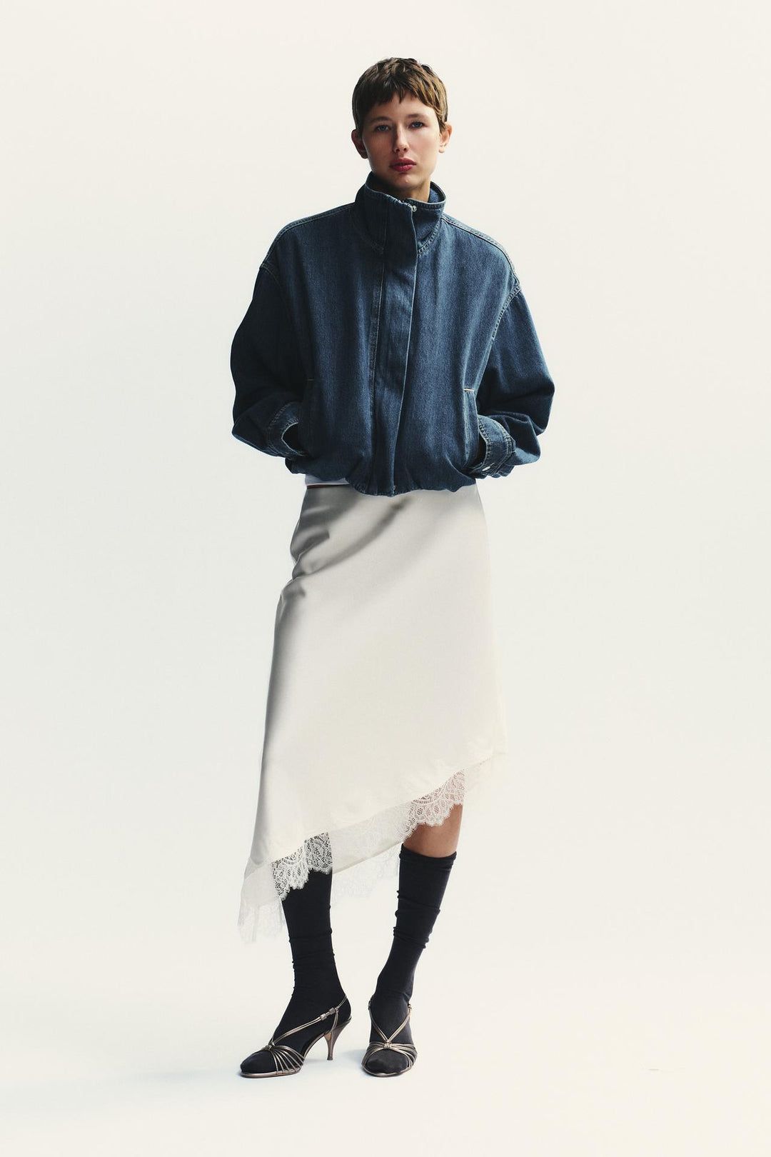 Classic vintage-inspired denim jacket with stand collar and balloon sleeves for women.